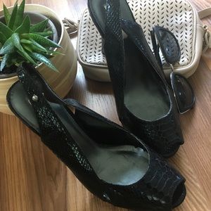 Black peep toe faux snake pumps